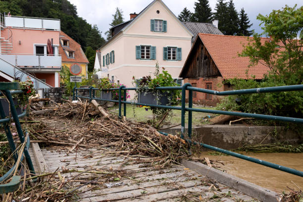 pressure of the flood water bent the railing of the bridge made of thick pip